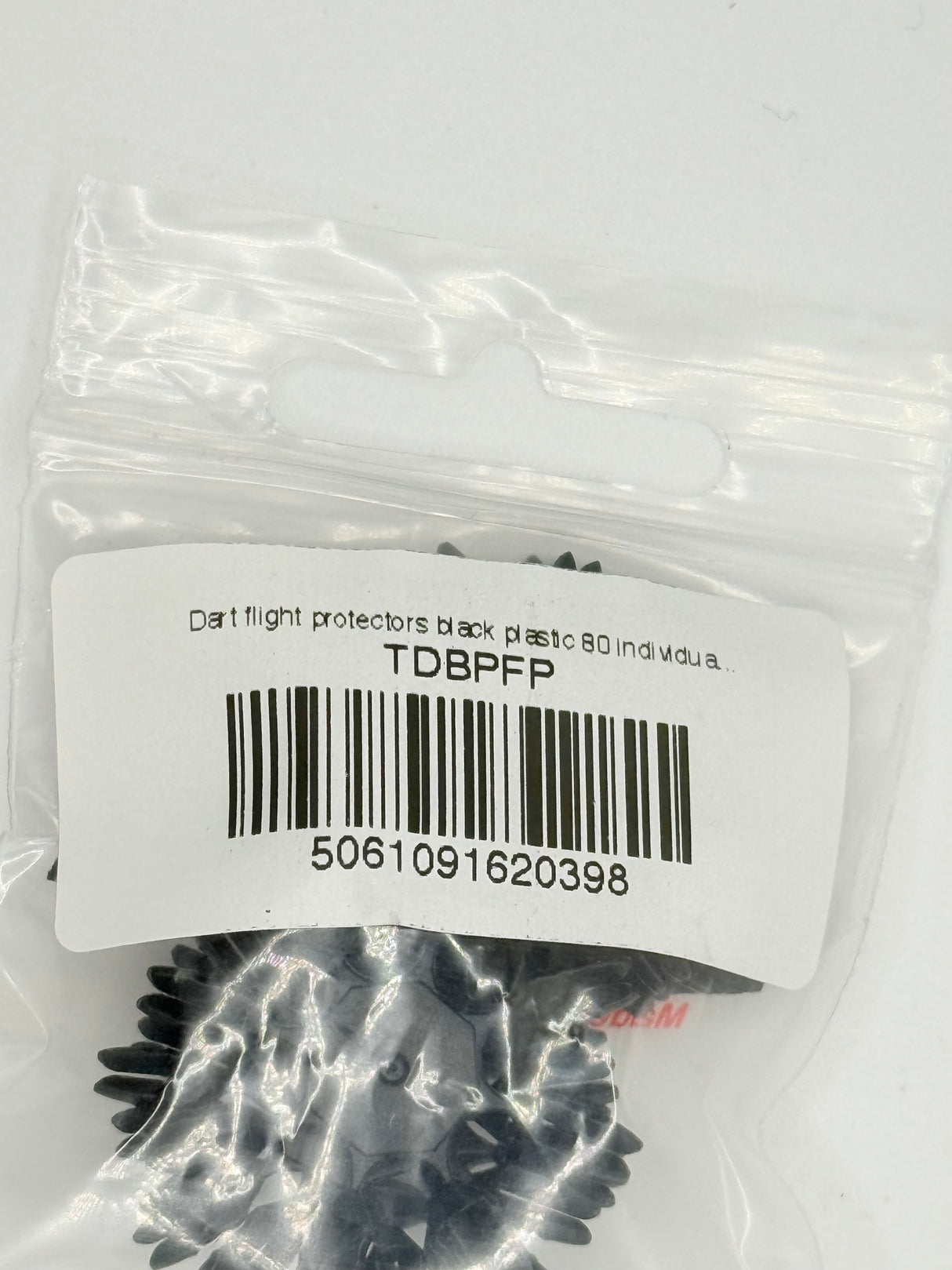 A black plastic dart flight protector designed to fit around the base of a dart flight. 8 Per ring. 10 rings per pack