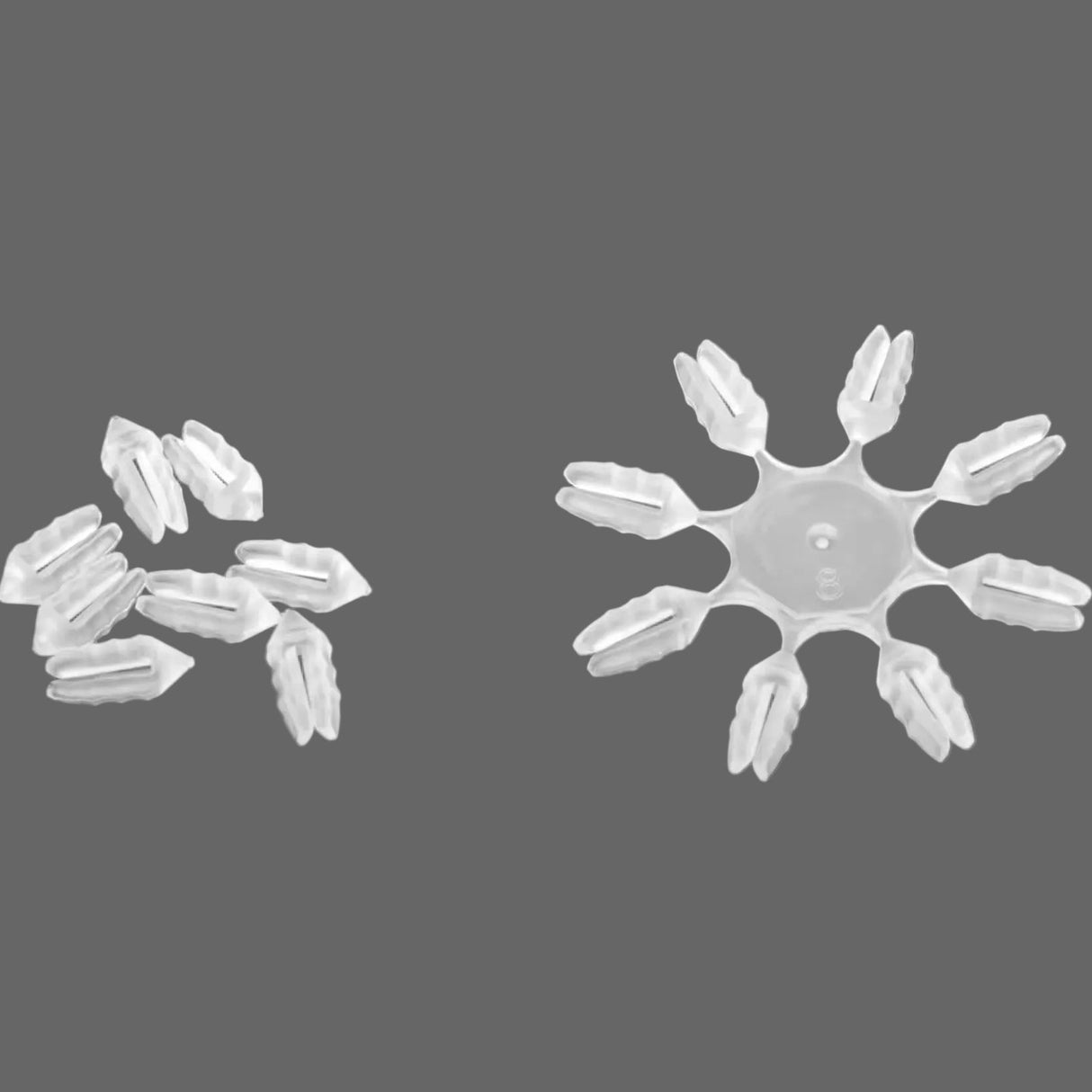 A clear plastic dart flight protector designed to fit around the base of a dart flight. 8 Per ring. 10 rings per pack